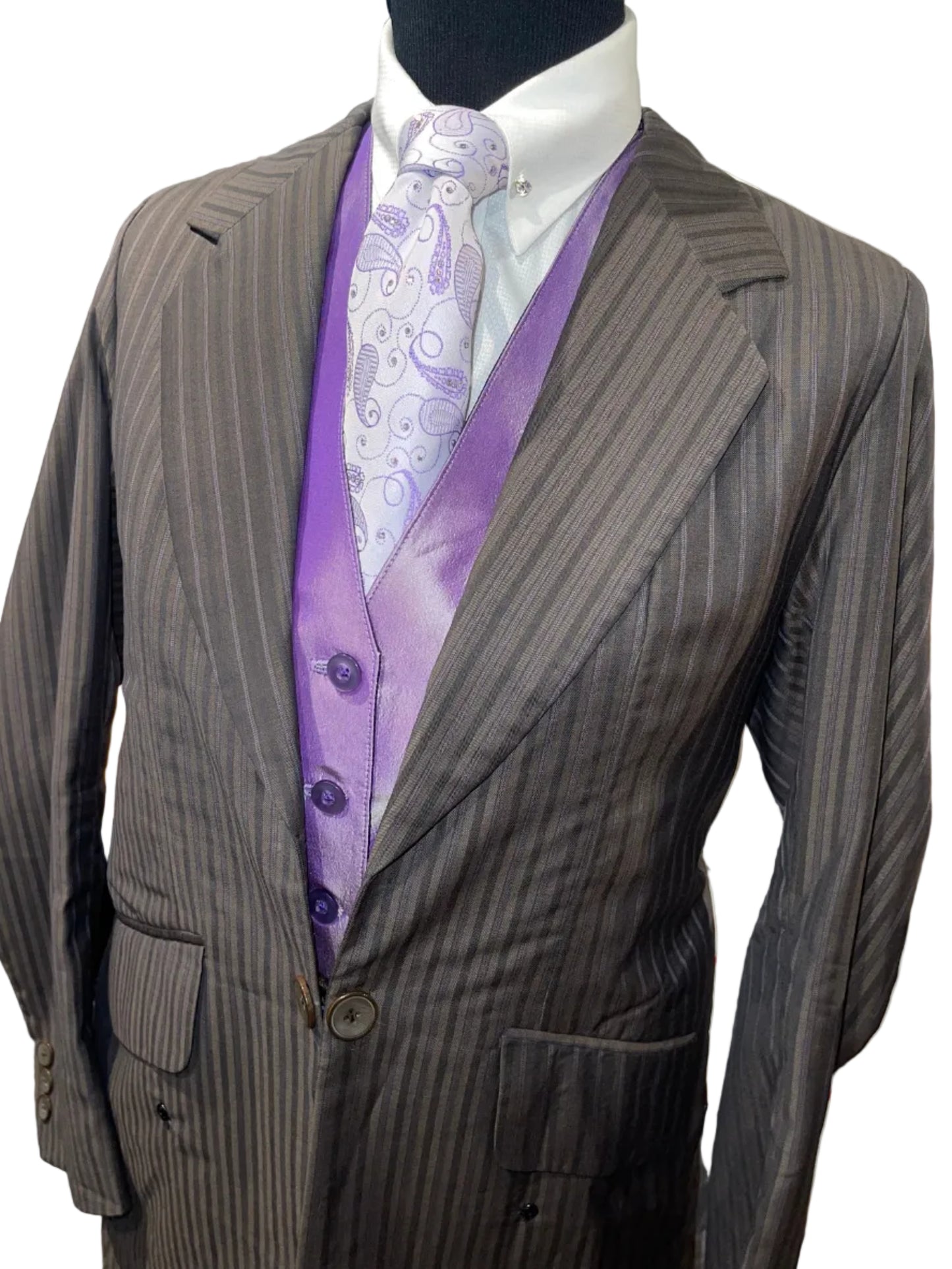 Marsha De Arriaga, Brown and Purple Suit