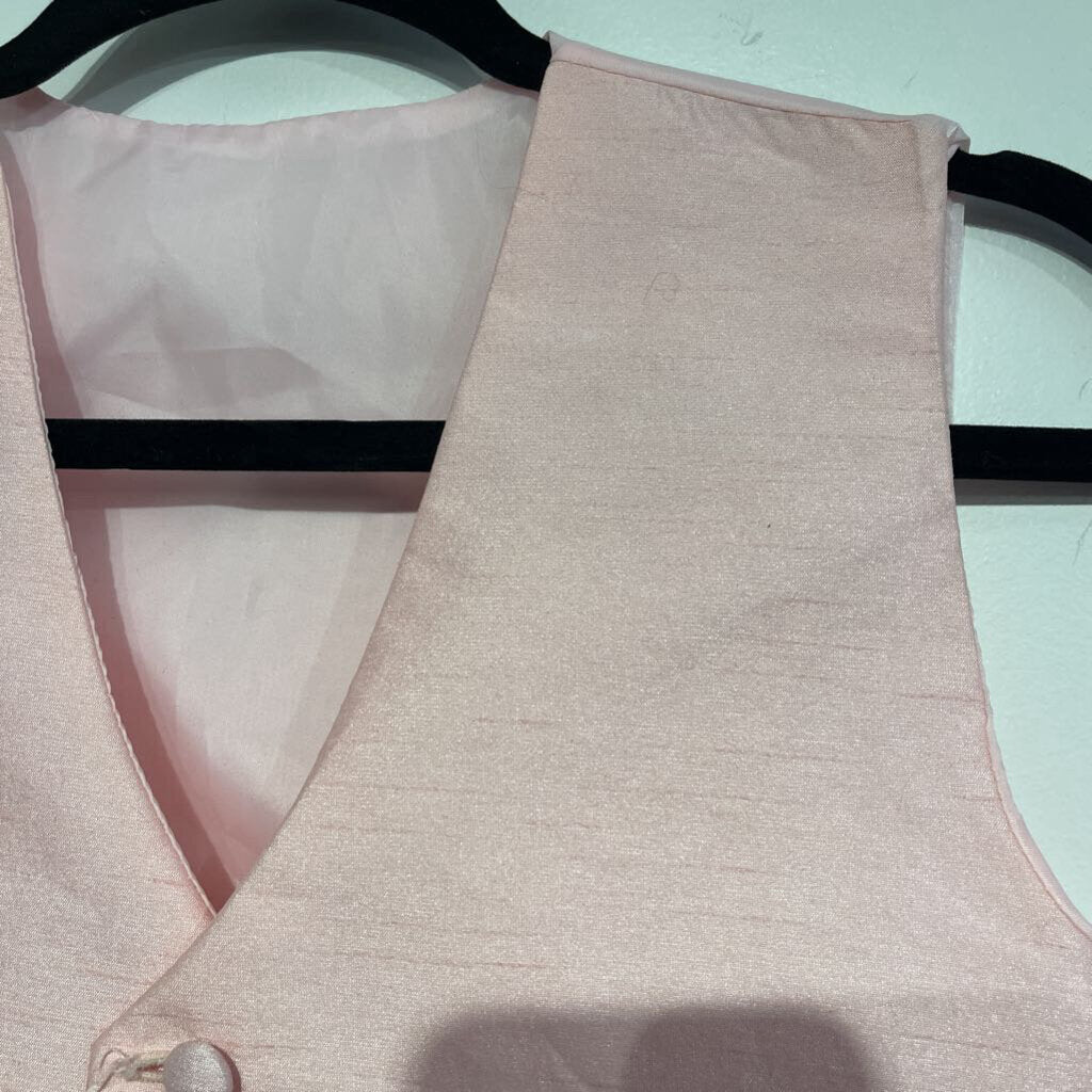 Pink Vest - slight rip in bottom